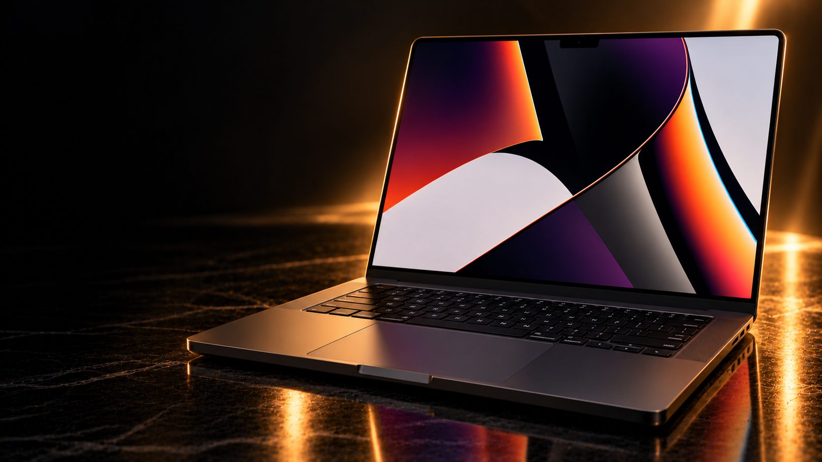 An open MacBook Pro 16-inch on a dark marble surface